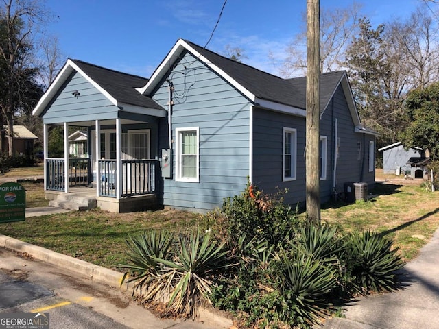 bungalow-style house featuring a porch and a front lawn