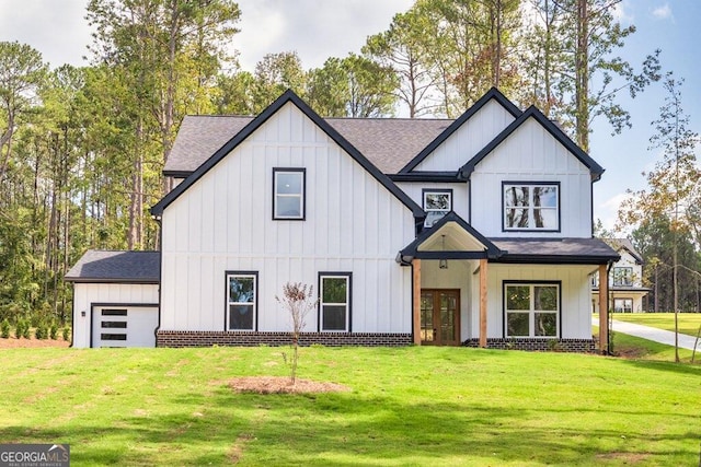 modern inspired farmhouse featuring a front lawn