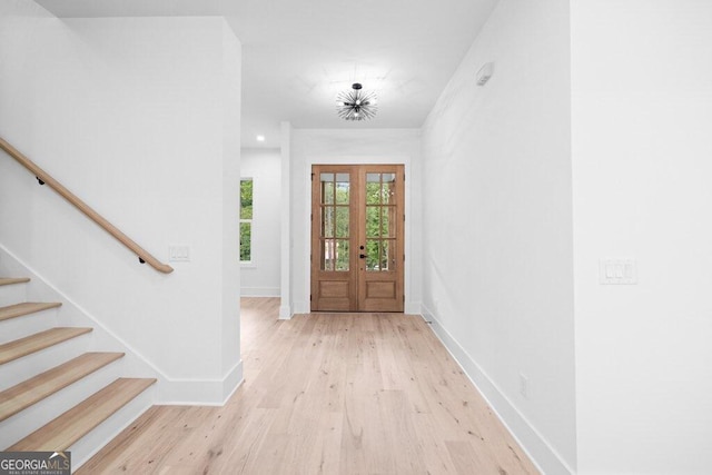 entryway featuring french doors and light wood-type flooring