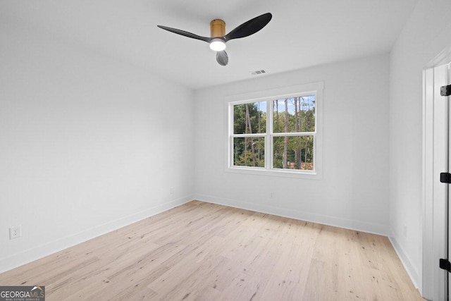 empty room featuring light hardwood / wood-style flooring and ceiling fan