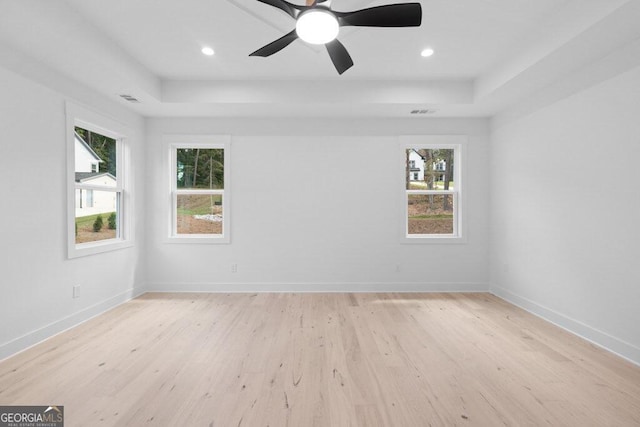 spare room with light hardwood / wood-style flooring and ceiling fan