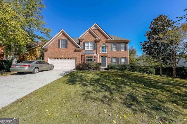 view of front of home featuring a front lawn and a garage