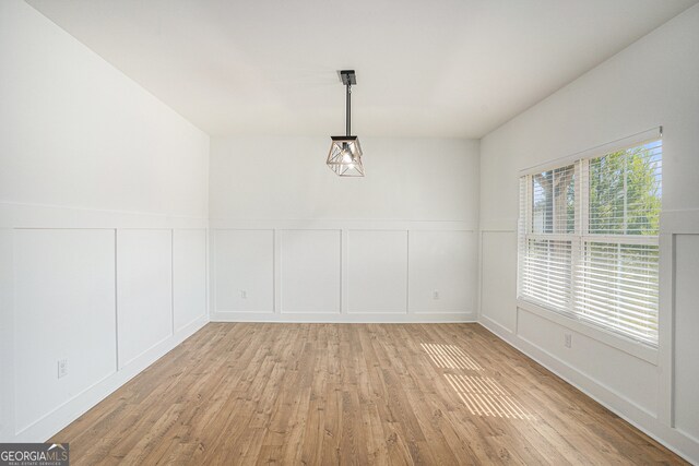 unfurnished dining area with light hardwood / wood-style floors