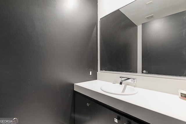 bathroom with visible vents and vanity