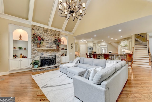 living room with light hardwood / wood-style floors, high vaulted ceiling, and built in features