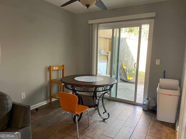 dining space featuring ceiling fan and wood-type flooring