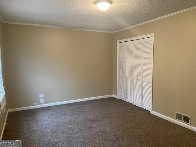 300 Flagstone Way, Austell, GA 30168 - unfurnished bedroom with a closet, baseboards, visible vents, and dark carpet