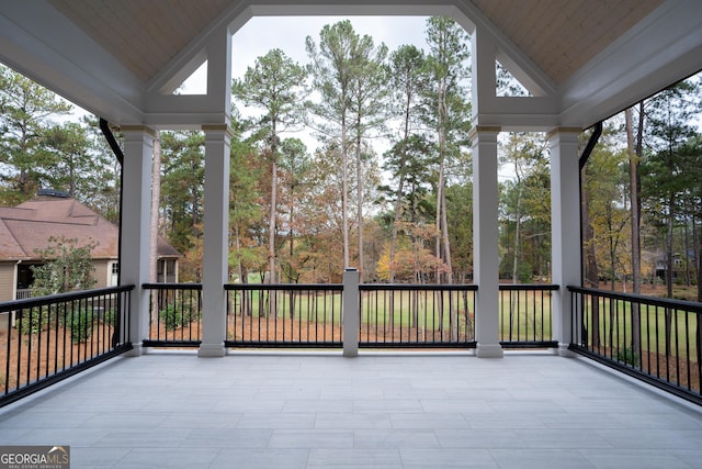 exterior space with vaulted ceiling