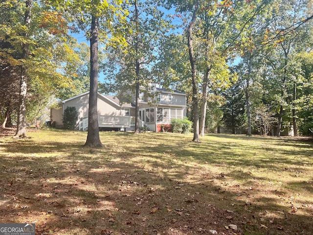 view of yard with a sunroom