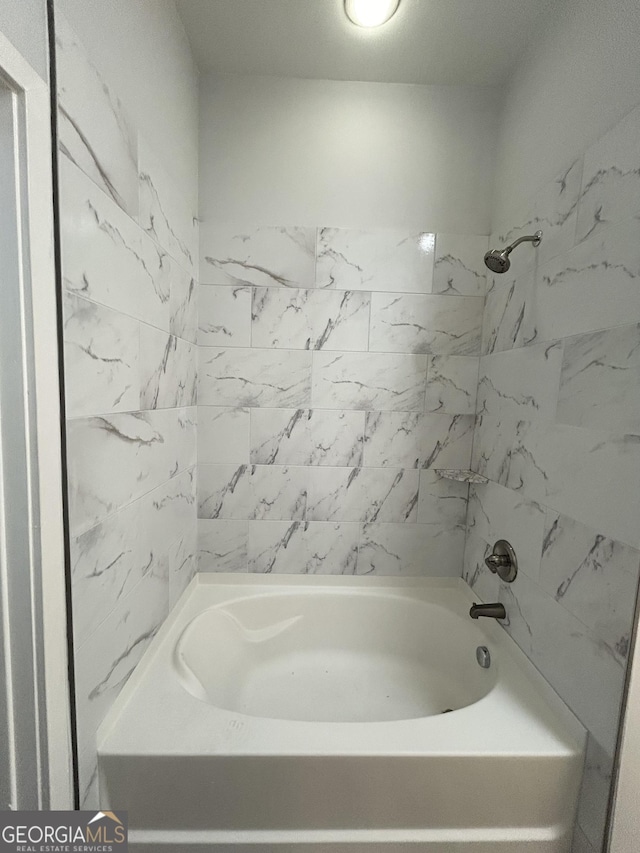 bathroom featuring washtub / shower combination