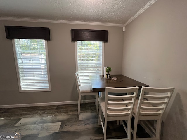 dining area featuring crown molding, a textured ceiling, and dark hardwood / wood-style flooring