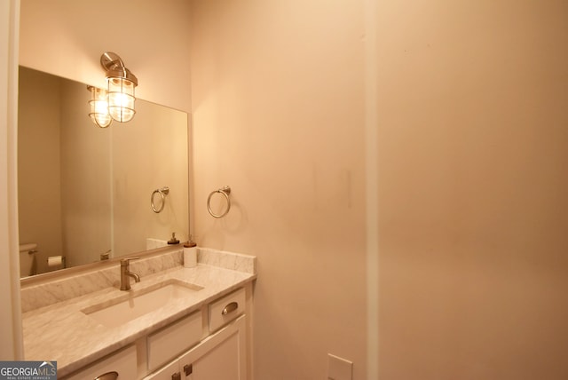 bathroom with vanity and toilet