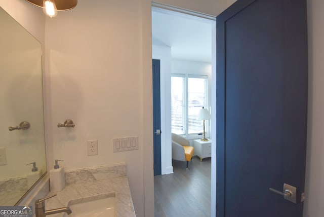 bathroom featuring vanity and hardwood / wood-style flooring