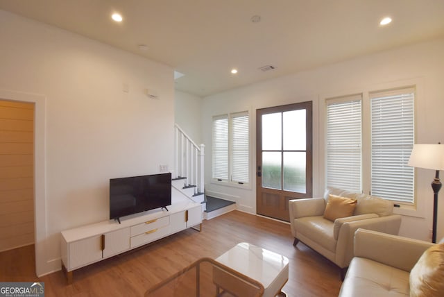 living room with light hardwood / wood-style floors