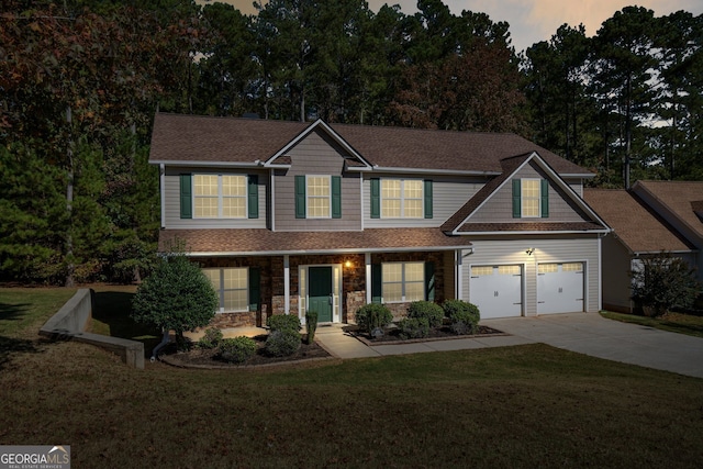 craftsman-style house with a lawn and a garage