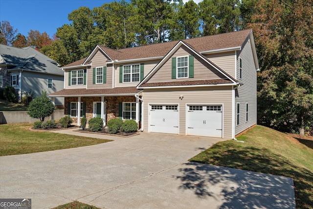 view of front of home with a garage and a front lawn