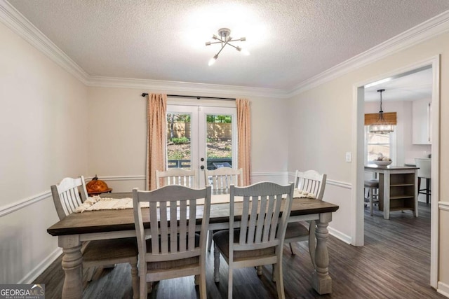 dining space featuring french doors, a textured ceiling, plenty of natural light, and dark hardwood / wood-style flooring