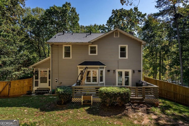 rear view of house with a lawn