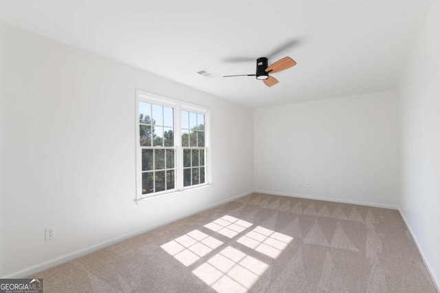 carpeted empty room with ceiling fan