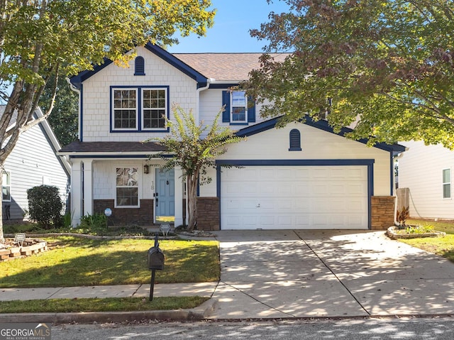 view of front of home featuring a front yard and a garage