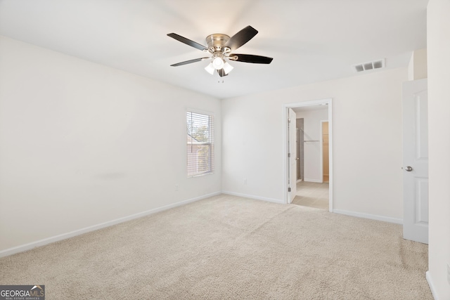 unfurnished bedroom featuring ceiling fan and light colored carpet