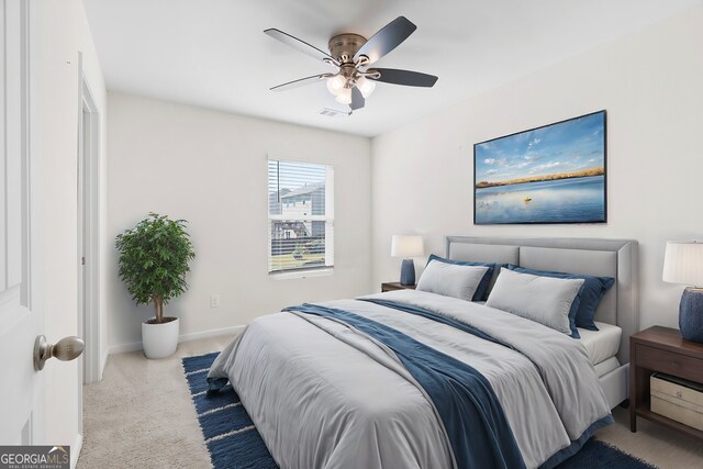 carpeted bedroom with ceiling fan