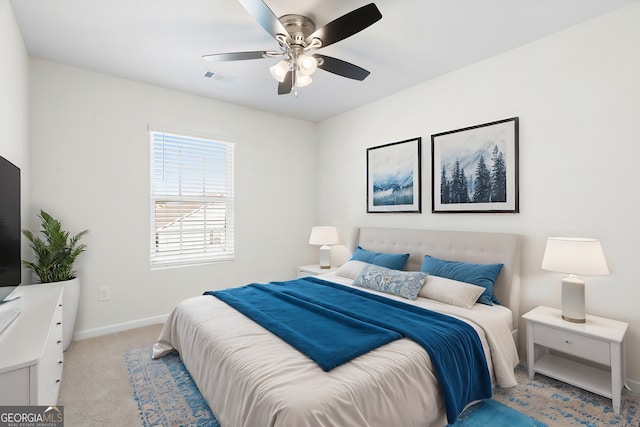 carpeted bedroom with ceiling fan