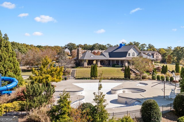 view of community with a patio and a hot tub