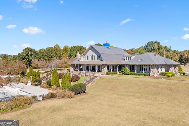 view of front facade with covered porch and a front lawn