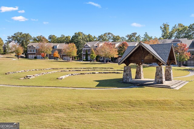 view of property's community with a gazebo and a lawn