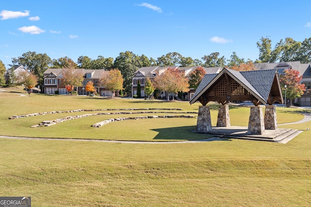 view of home's community with a gazebo and a yard