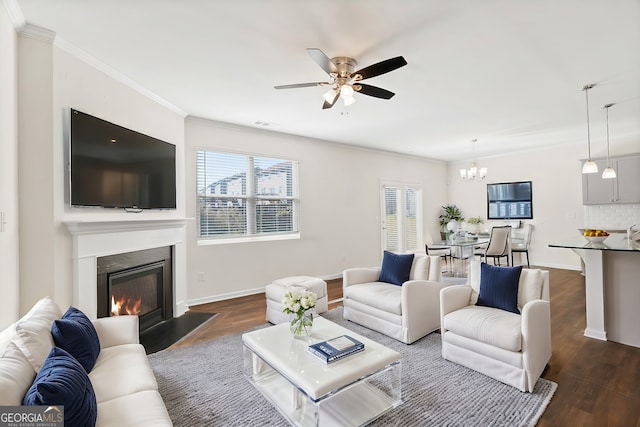 living room featuring ornamental molding, plenty of natural light, and dark hardwood / wood-style floors