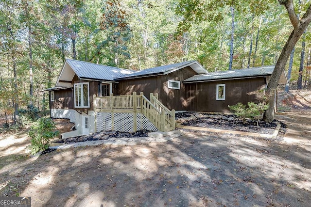 view of front of house featuring a wooden deck