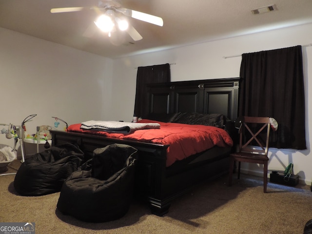 bedroom with ceiling fan and carpet floors