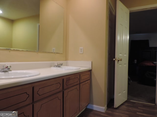 bathroom with vanity and hardwood / wood-style flooring