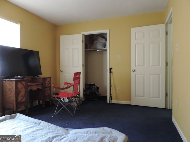 carpeted bedroom featuring a closet