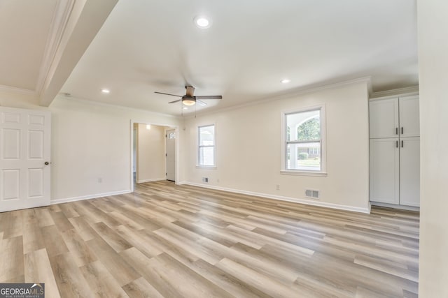 unfurnished room with crown molding, light hardwood / wood-style flooring, and ceiling fan