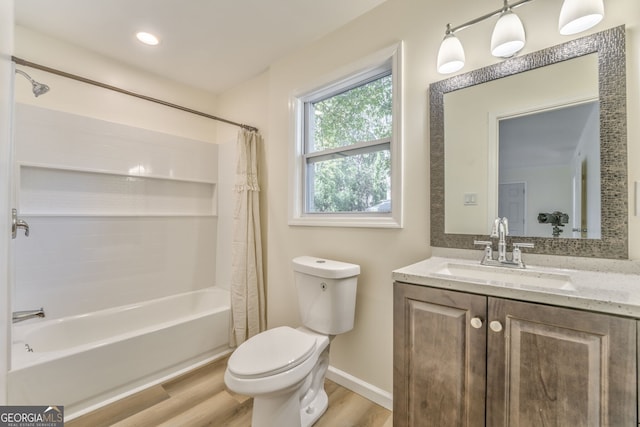 full bathroom featuring vanity, toilet, shower / tub combo, and hardwood / wood-style floors