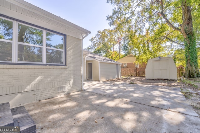 view of patio / terrace featuring a storage unit