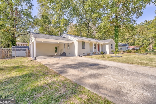 single story home with a front lawn and a carport