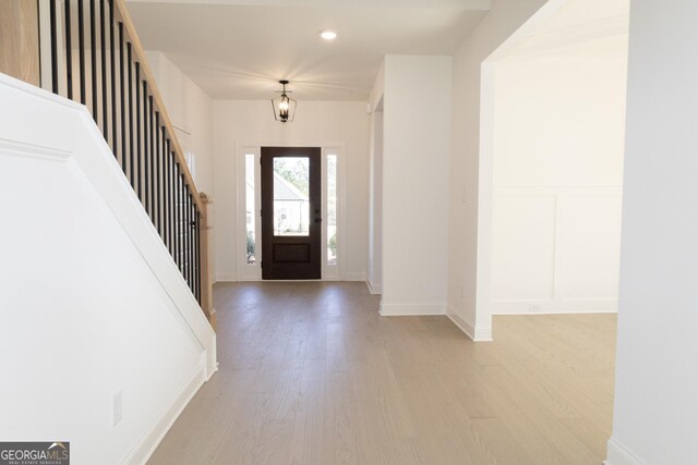 entryway with light hardwood / wood-style flooring