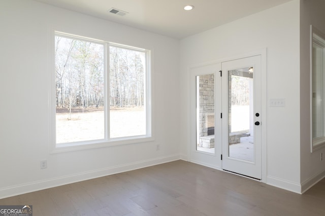 doorway with wood-type flooring