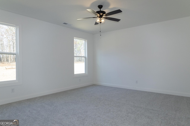 empty room featuring carpet and ceiling fan