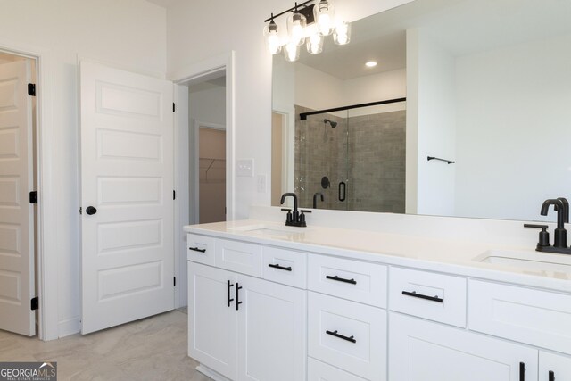 bathroom featuring vanity and a shower with shower door