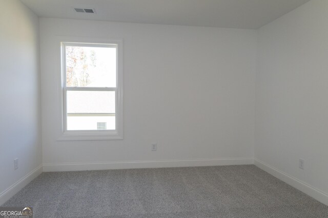 spare room featuring carpet flooring