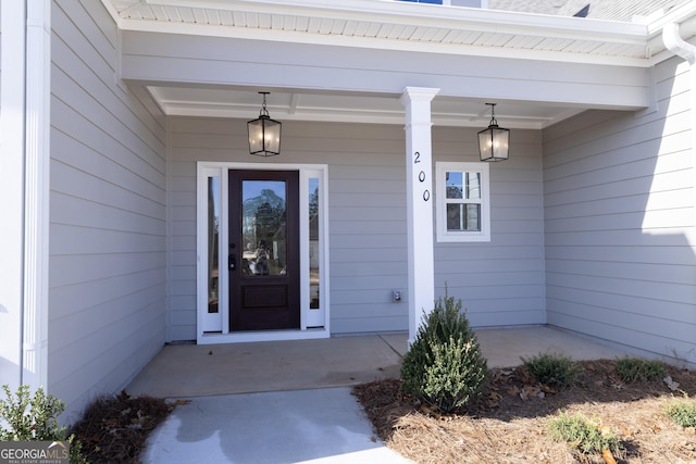 doorway to property featuring a porch