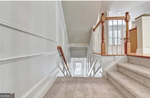 stairs with carpet flooring