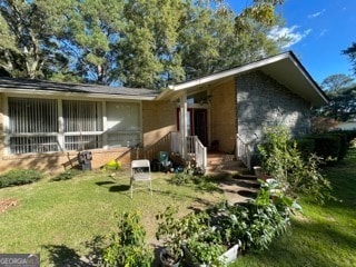 exterior space with a front yard