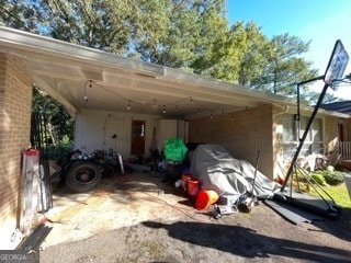 view of parking / parking lot with a carport