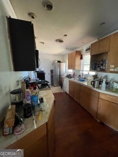 kitchen featuring stainless steel fridge